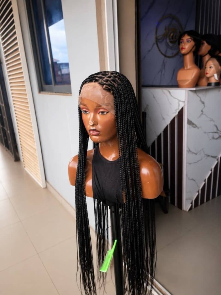 Long braided lace front wig styled at Mibest Beauty